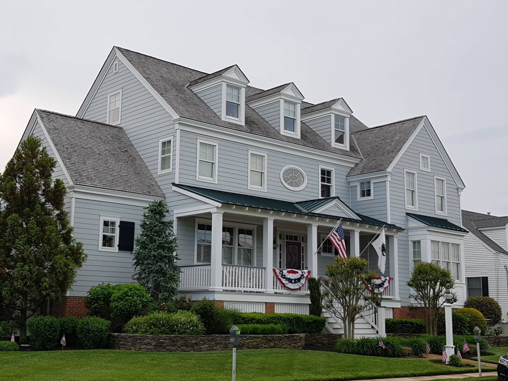 A large white and timbered house in Bergen County, New Jersey, in autumn