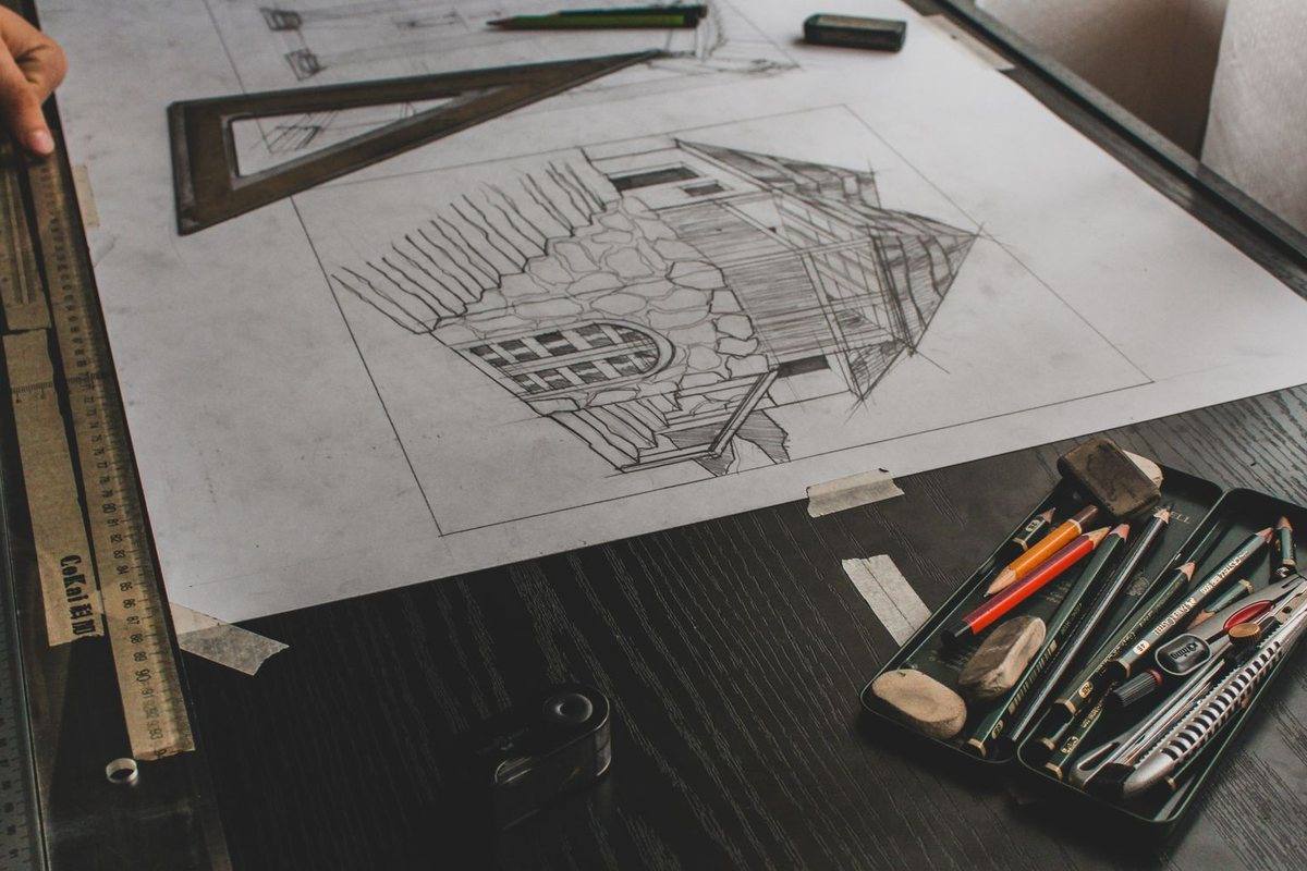 Architectural drawings and a scale rule on a work table