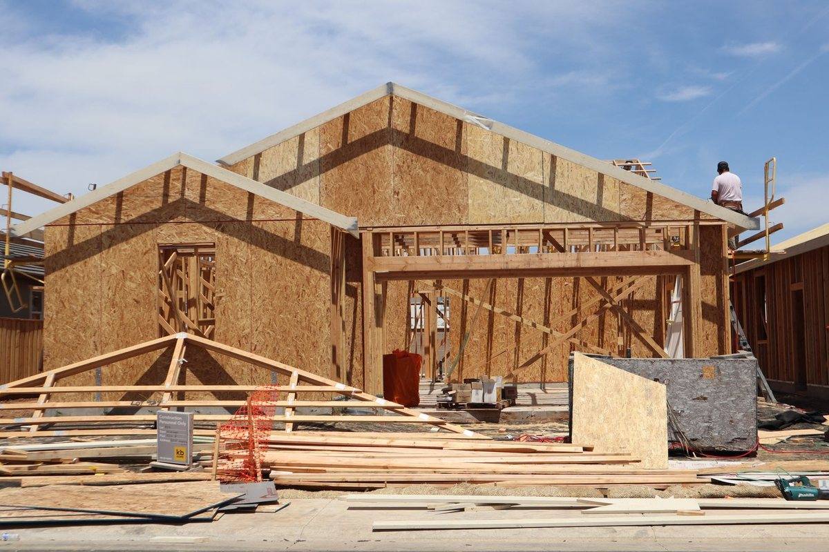 A large timber-framed extension under construction