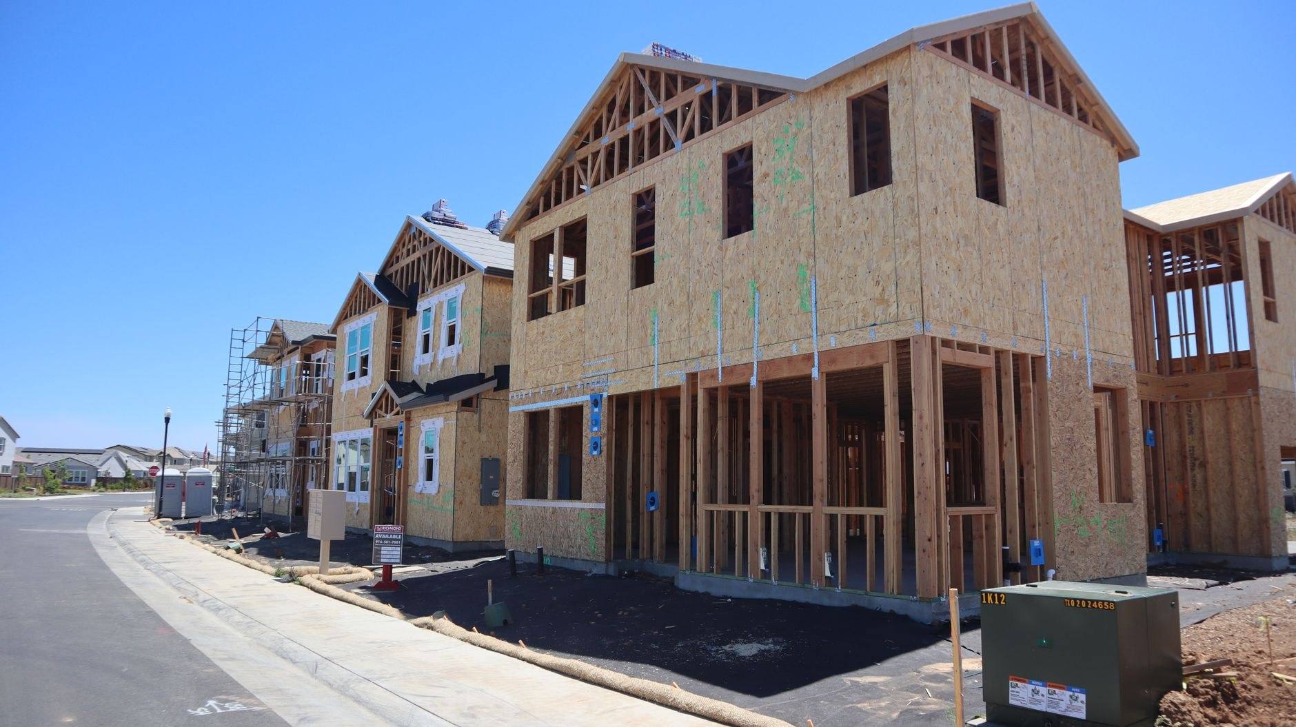 A house addition under construction, framed and sheathed