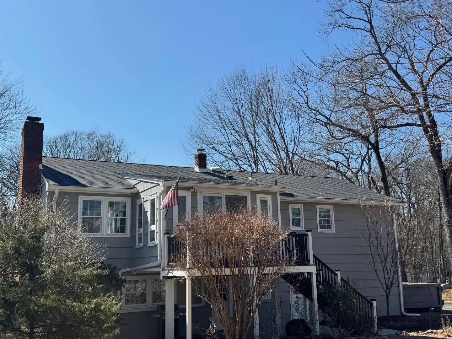 A second view of the rear of the Franklin Lakes house, the new Charcoal roof running over the whole back elevation