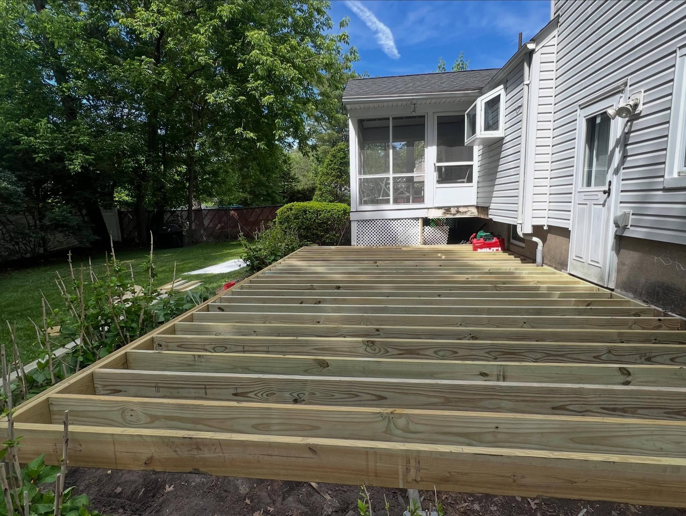 New pressure-treated framing going down on the four-day deck
