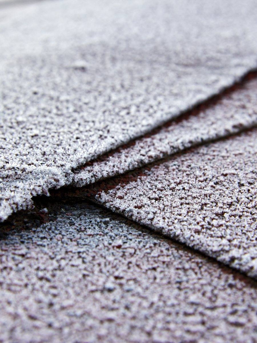 Close view of an architectural asphalt shingle valley