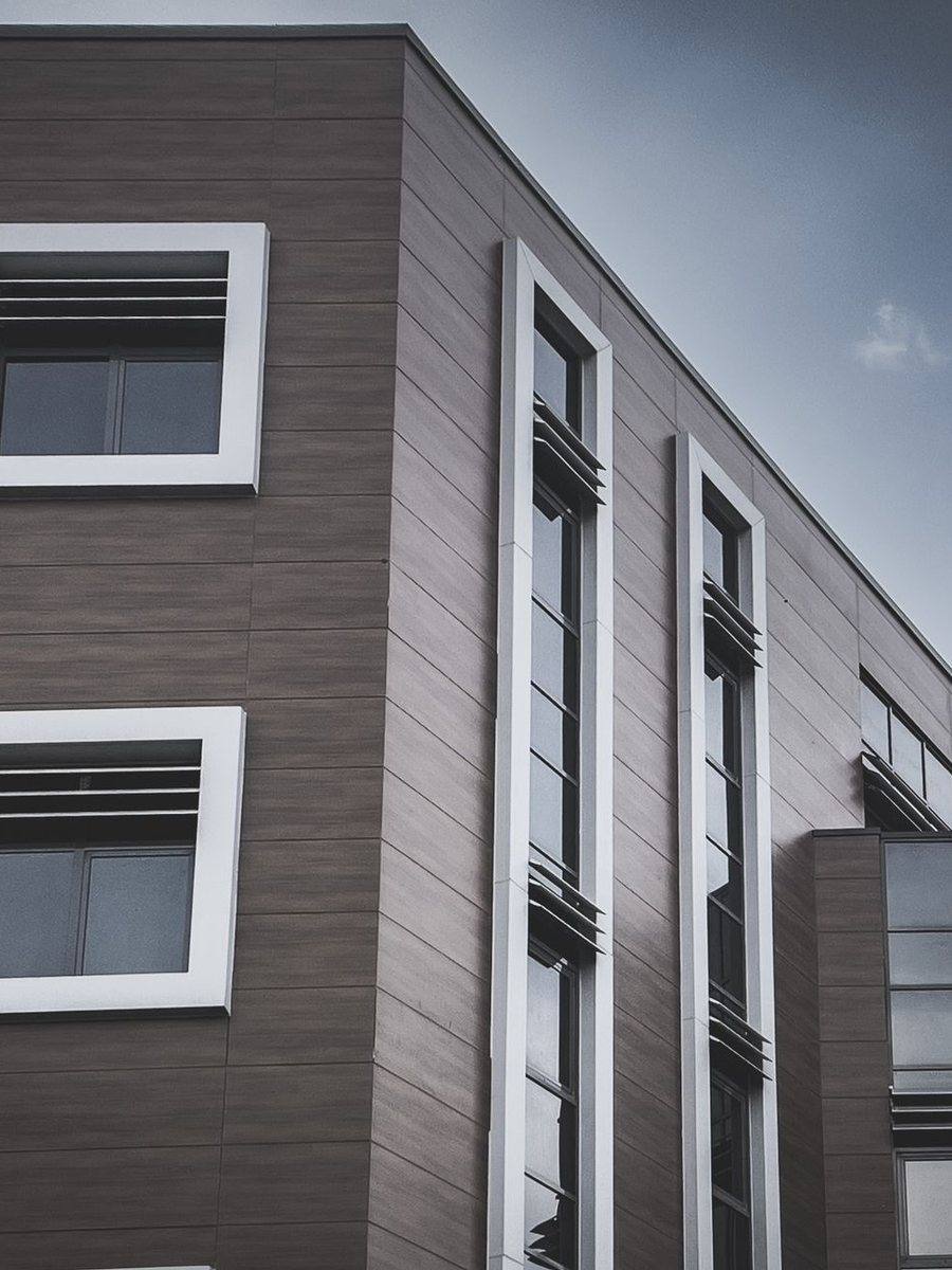 Dark gray fiber cement panels on a modern house facade