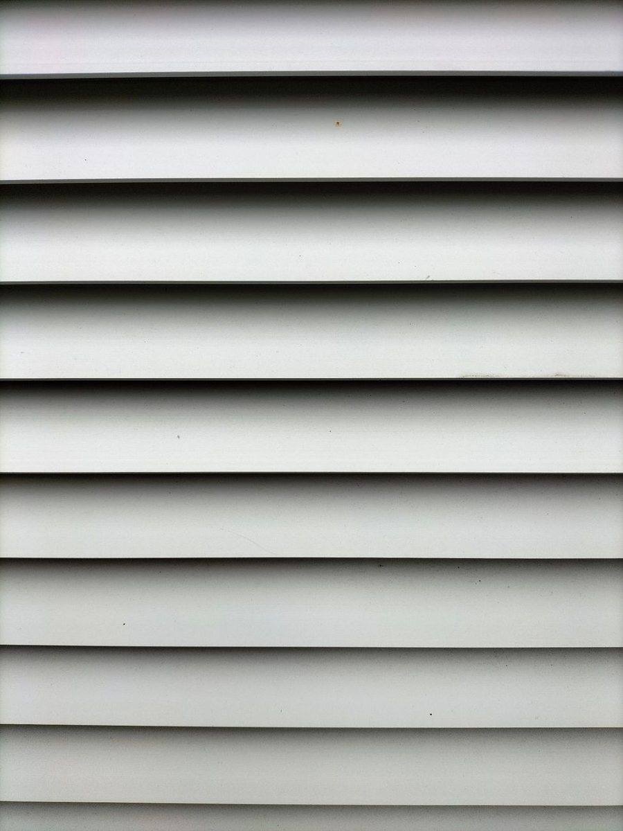 Clean horizontal siding profile in soft gray